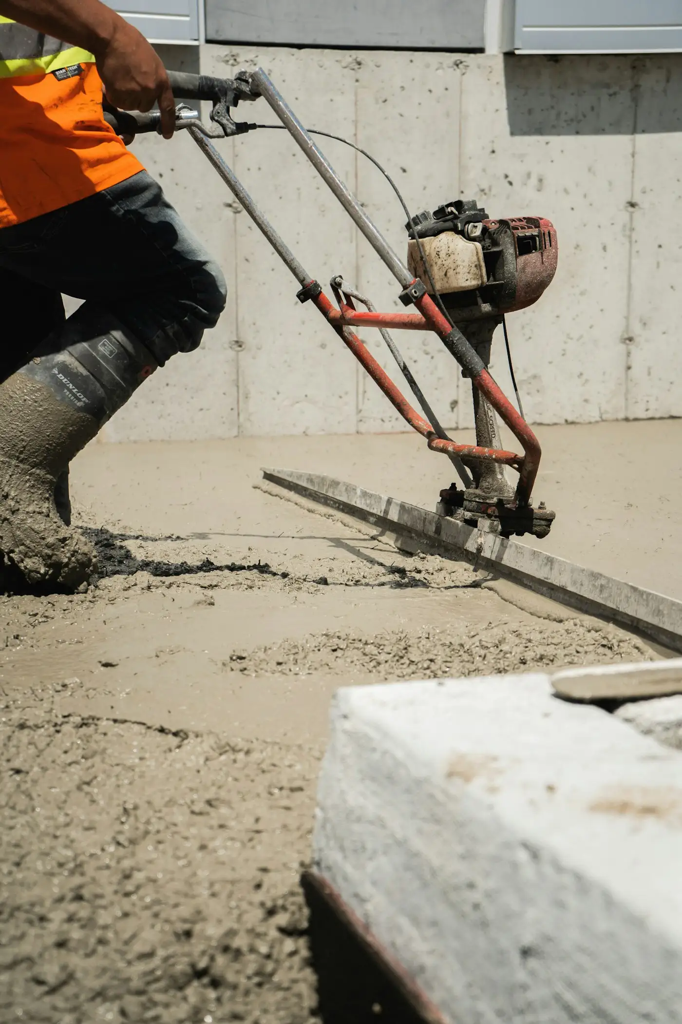 Concrete being pumped into a foundation wall form