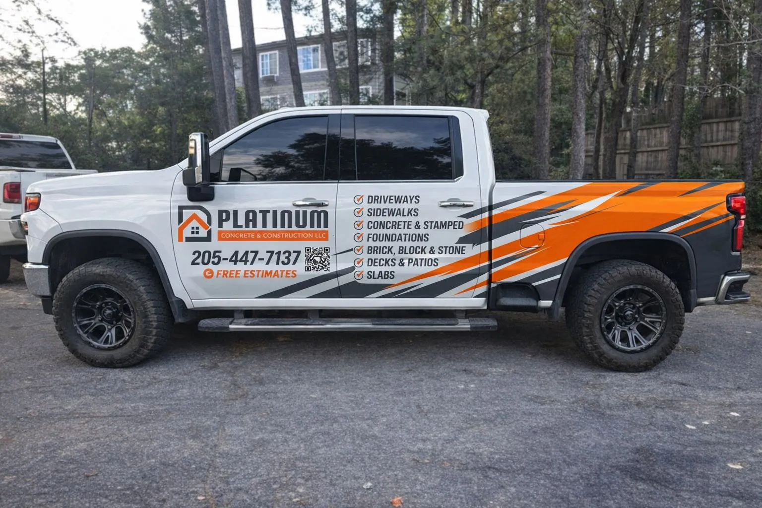 Platinum Concrete & Construction work truck with the company logo and phone number